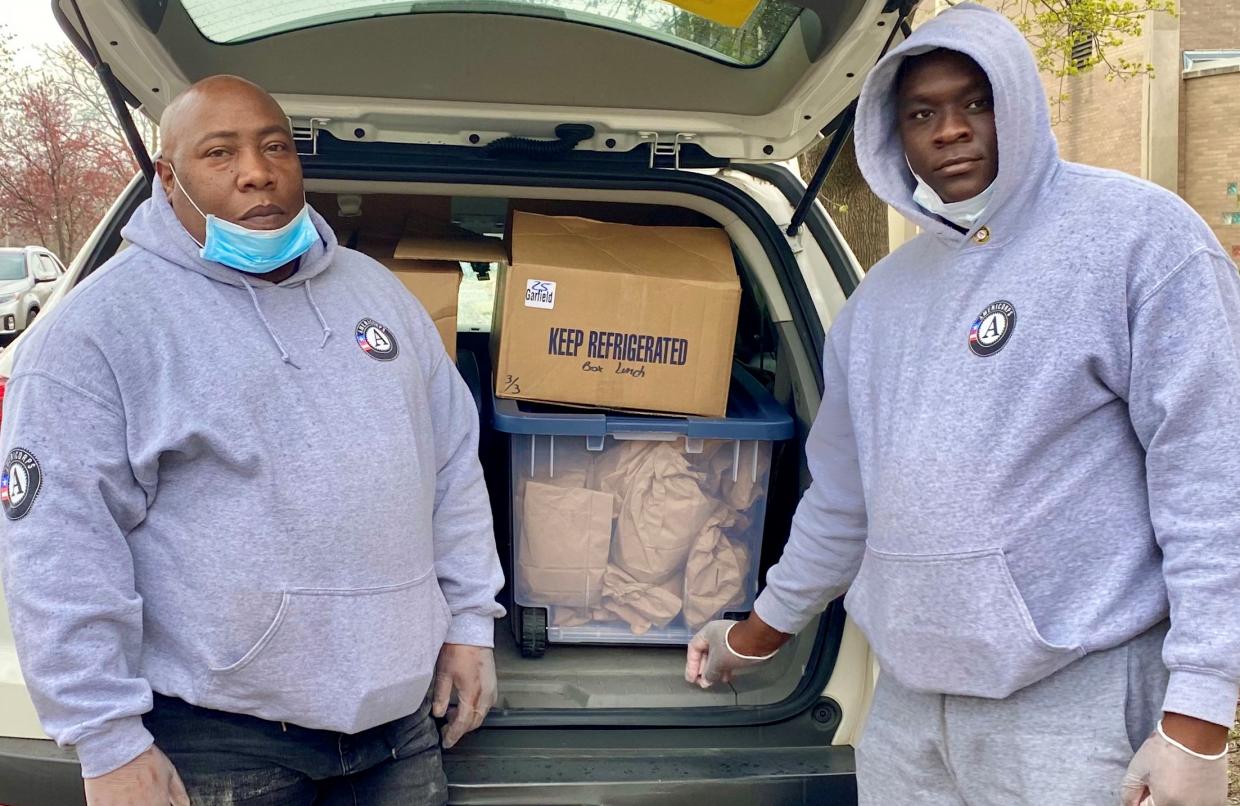 Housing Forward AmeriCorps Members deliver food.