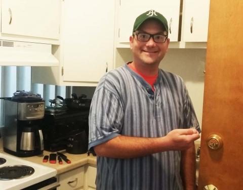 man standing in kitchen