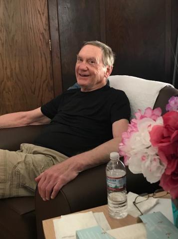 Man sitting in chair smiling