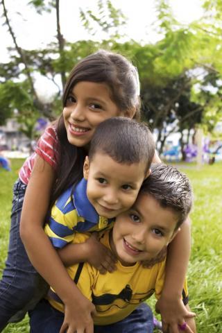 kids playing in the grass 