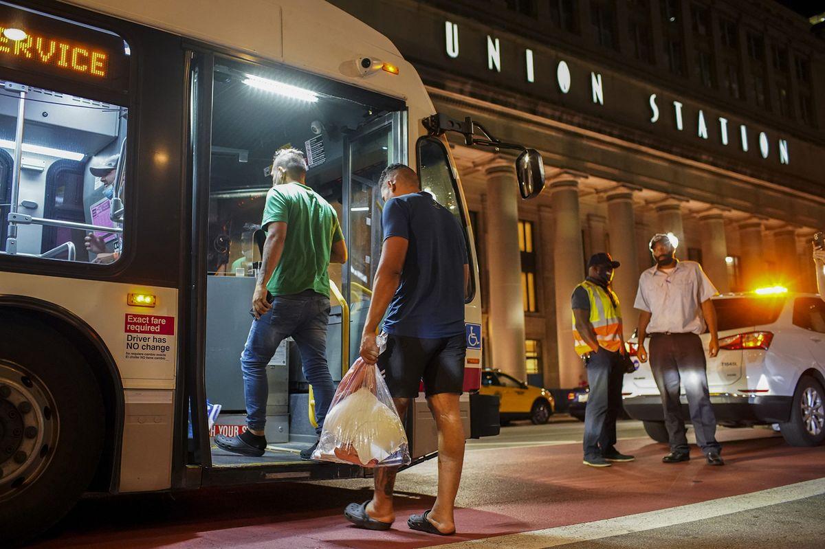 Immigrant boards bus in Chicago