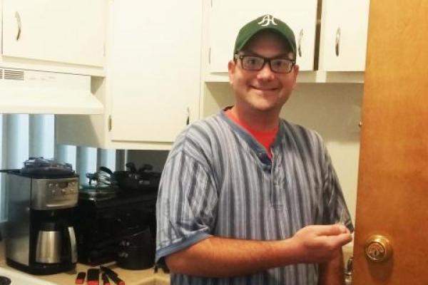 man standing in kitchen