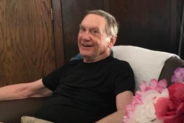 Man sitting in chair smiling