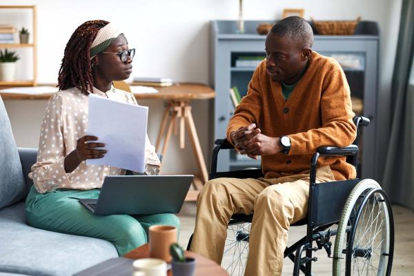 Man in Wheelchair with Case Manager