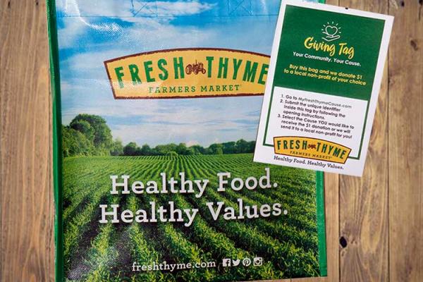 Special Fresh Thyme Market Giving Bags Hold Shelter Donations