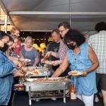 Guests help themselves to pork sliders