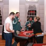 Guests  enjoy conversation with the casino table dealer