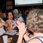 Trivia night attendees cheer